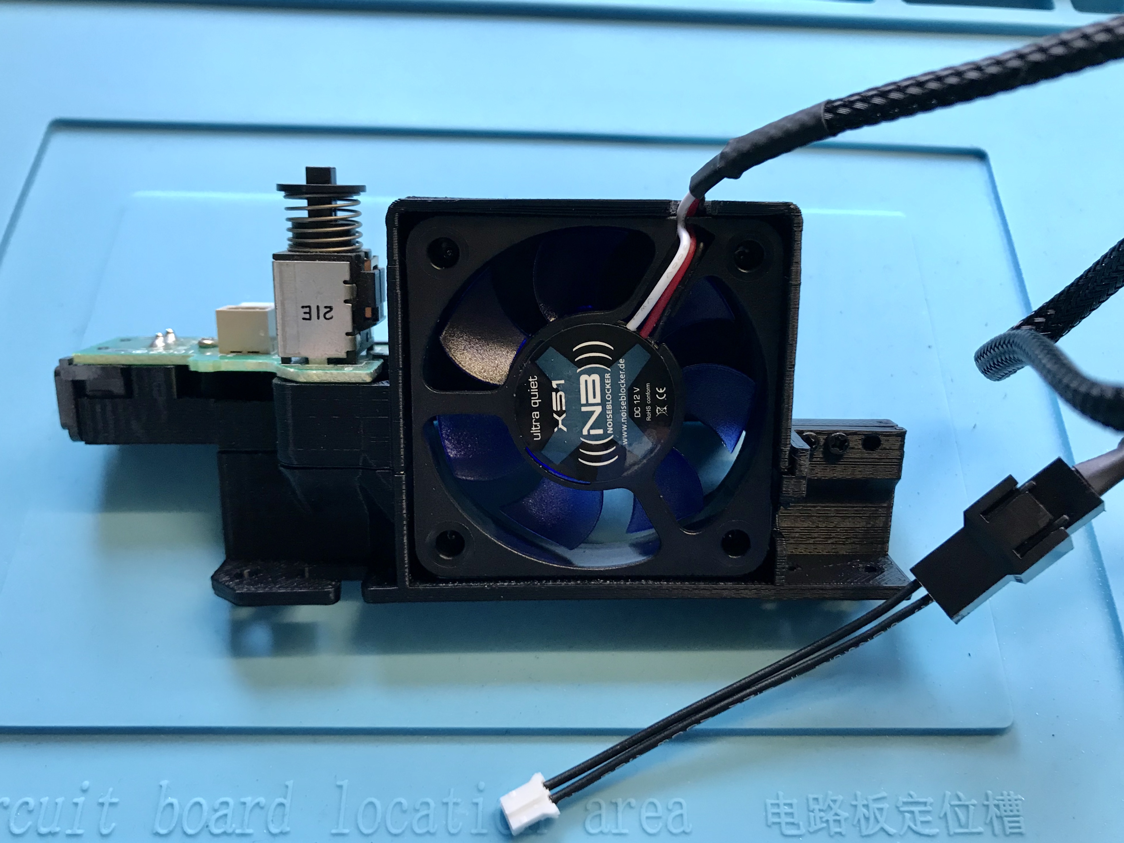 Fan mount with fan power switch board and cable adapter fitted ready for installation into GameCube
