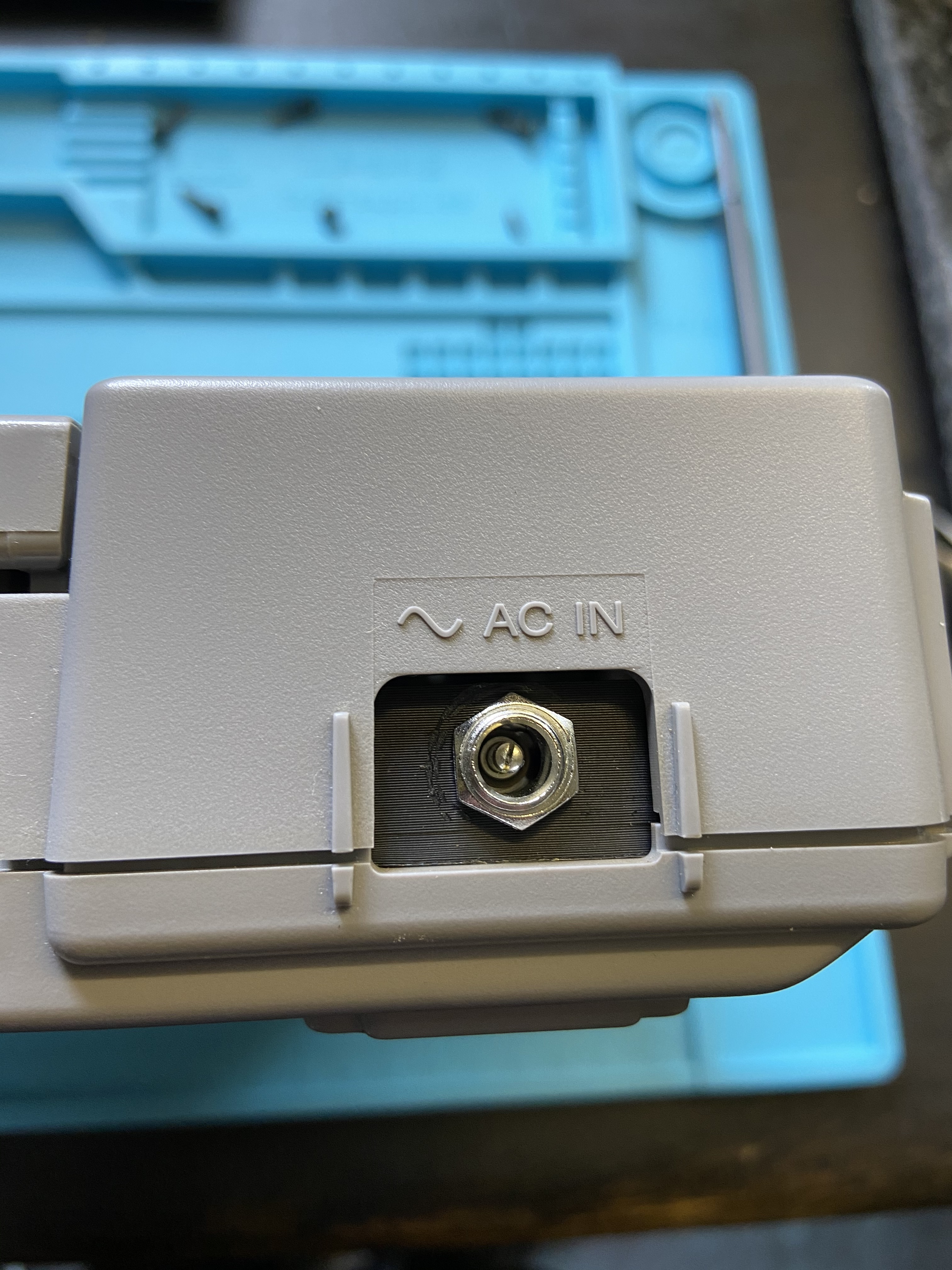 Aftermarket DC input jack installed in a PlayStation