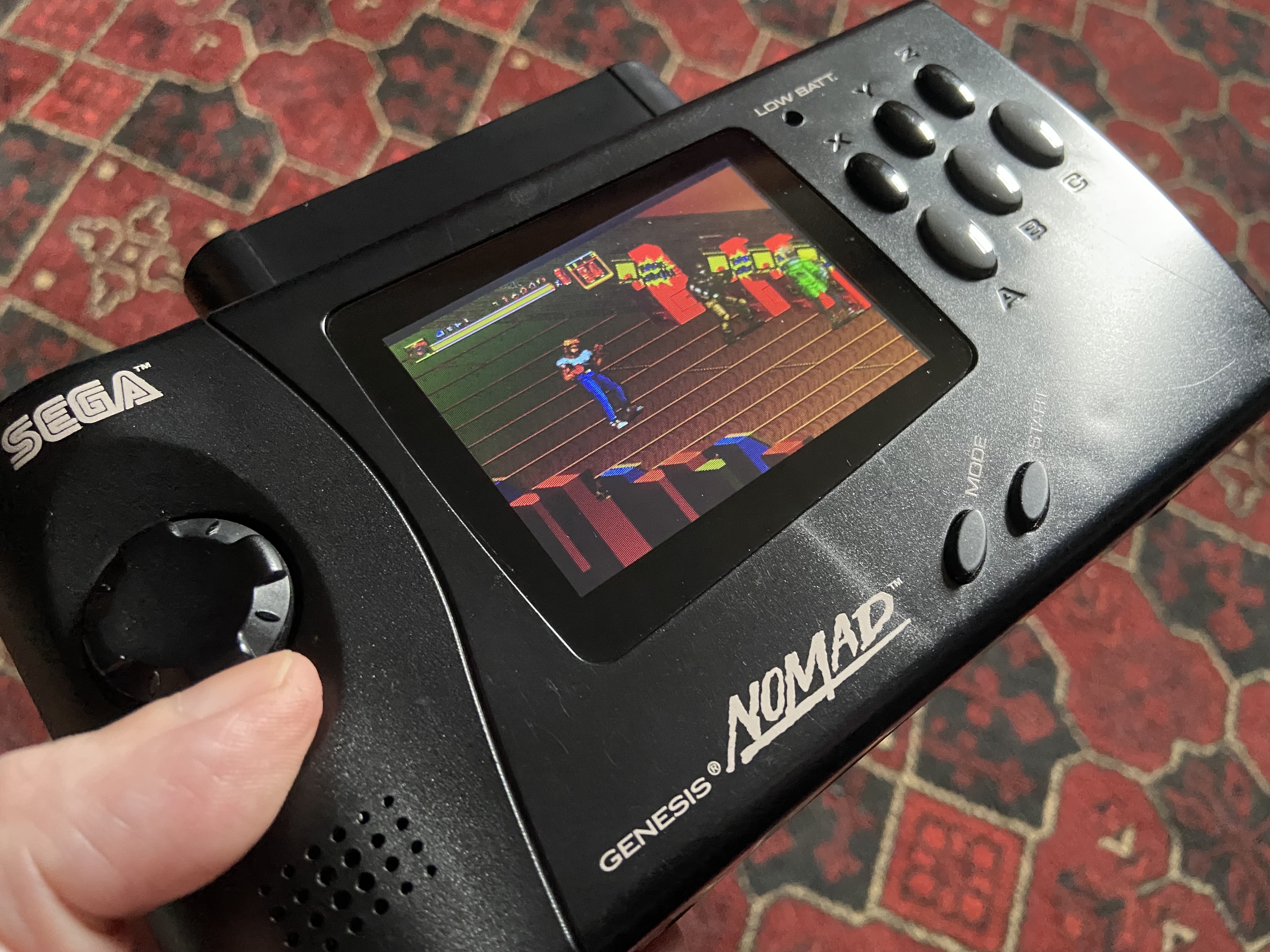 SEGA Nomad with aftermarket battery pack and TFT screen