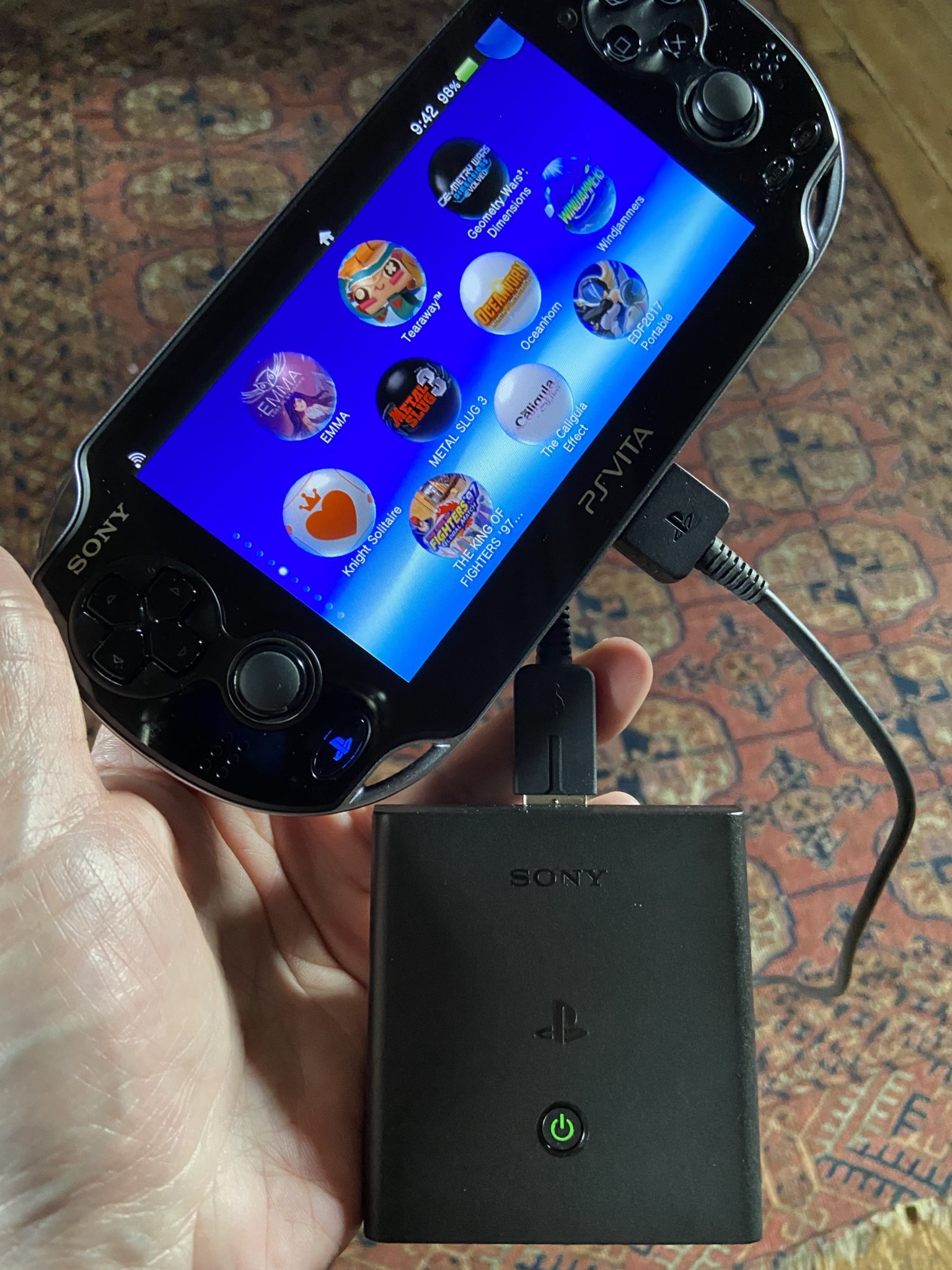PlayStation Vita with the Portable charger attached